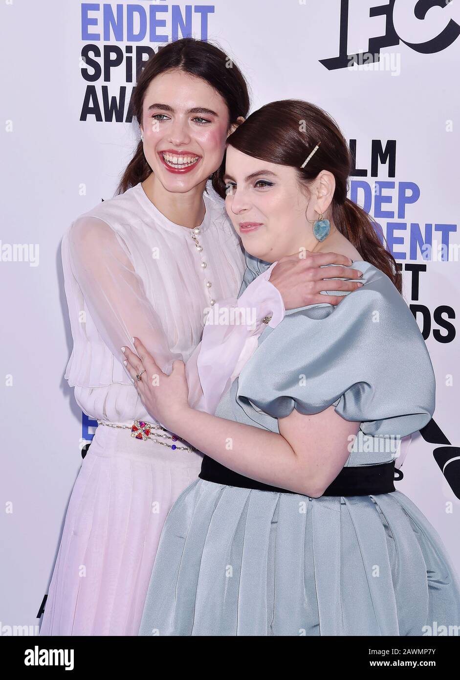SANTA MONICA, CA FEBRUARY 08 Margaret Qualley (L) and Beanie Feldstein attend the 2020 Film