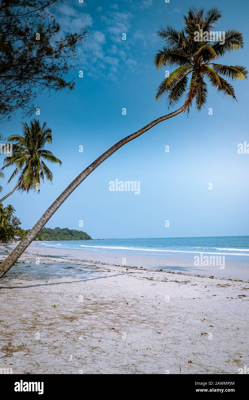 Thung Wua Laen beach Chumphon Thailand, couple on the beach by palm tree hanging on the white beach  Stock Photo