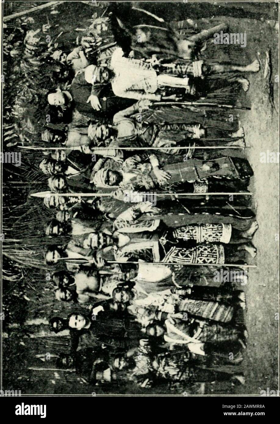 The inhabitants of the Philippines . o o. O 2 O &lt; BAGOBOS: THEIR BAPTISMS 351 and they were, till the Spanish-American war, under thespiritual care of the veteran missionary, Father Urios, andhis assistants. In October, 1894, 400 Bagobos were bap-tized. I am unable to give the numbers of the Bagobos,even approximately, but, from the small territory theyoccupy, they cannot be numerous. The illustration shows the celebrated Datto Manib, oneof the principal baganis (head-murderers) of the Bagobos,of the Apo, accompanied by his lance-bearers, one of whomholds the quiap. Behind him are some of h Stock Photo