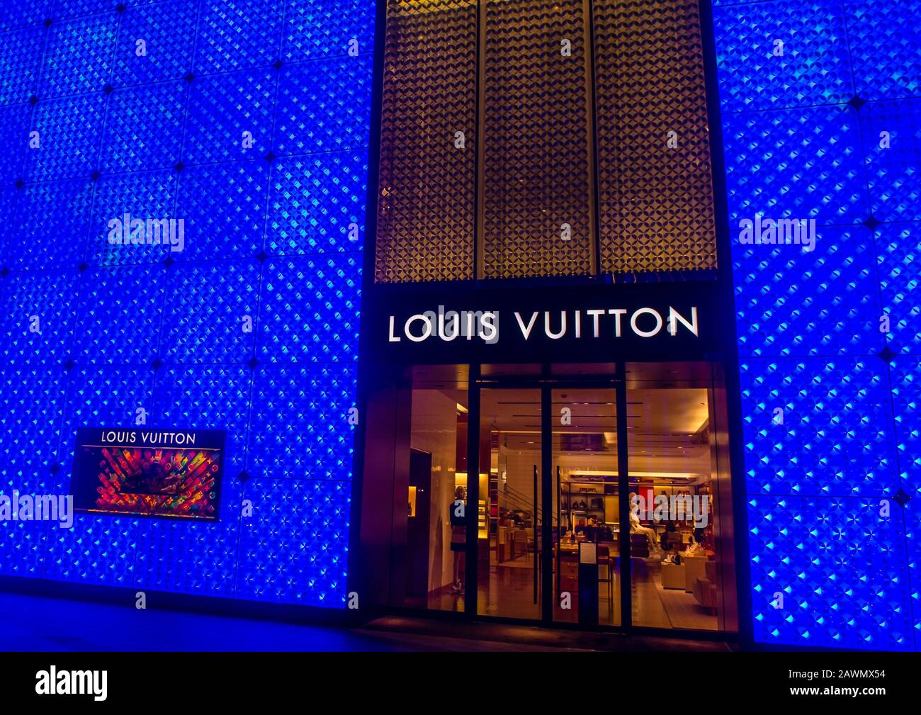 Moscow, Russia - December 1, 2019: Louis Vuitton storefront, multicolored  rainbow background backdrop design, glasses scarf and two bags with a logo.  Bright hologram fluorescent color – Stock Editorial Photo © OlaKorica  #327143390