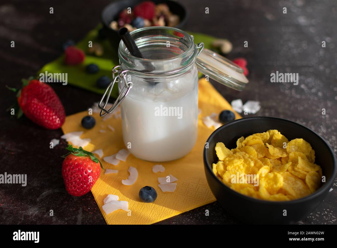 Organic coconut rice drink with coconut flakes in a preserving jar with