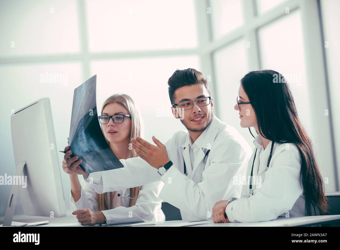 Female medical intern discussing patients hi-res stock photography and ...
