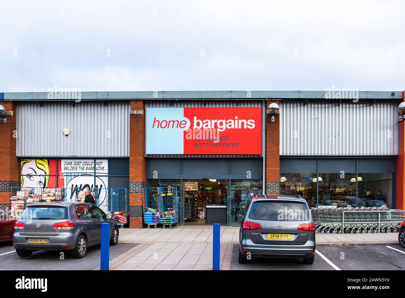 Front of a Home Bargains discount shop with shopping trolleys and racks of goods  in Trowbridge Wiltshire Stock Photo
