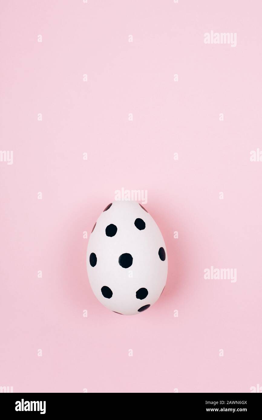 Easter egg on trendy pink pastel background. Flat lay style Stock Photo ...