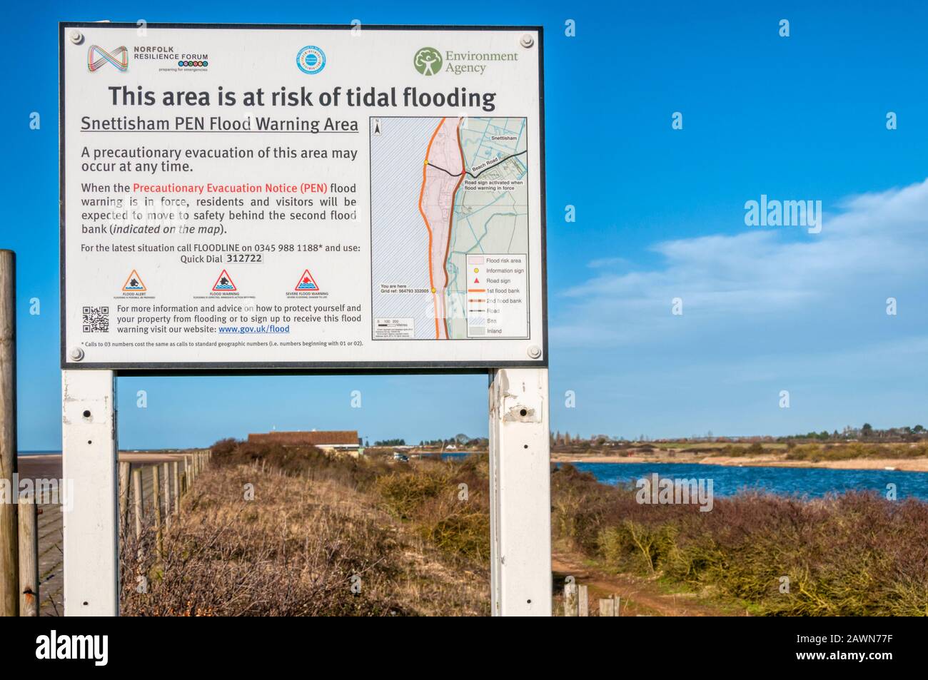 Sign warning of the risk of tidal flooding at Snettisham on the east coast of The Wash. Stock Photo