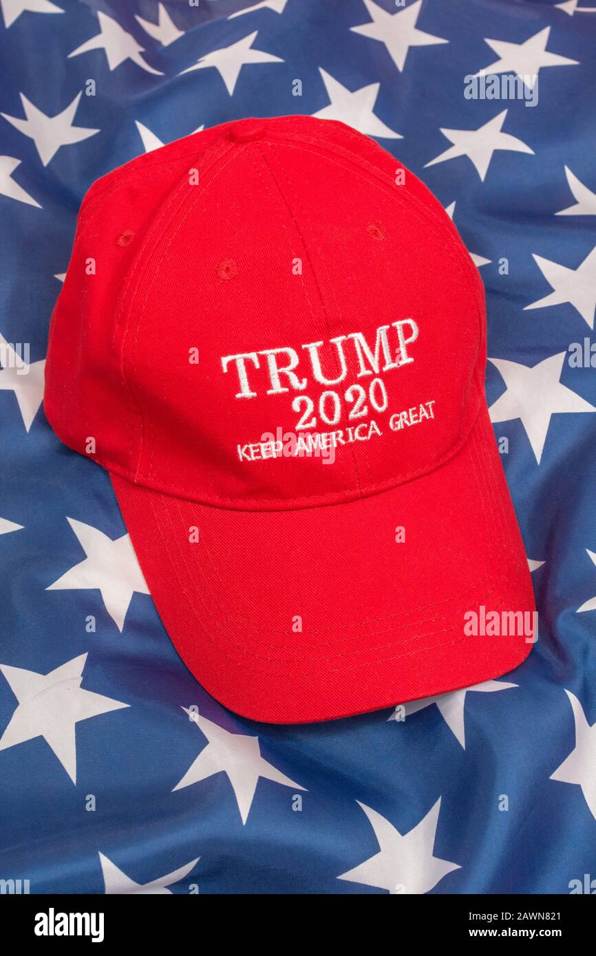 Trump 2020 campaign hat / KAG cap + Stars & Stripes. Trump supporters, 2020 election campaign, 2020 US election, Keep America Great, Trump Red Wave. Stock Photo