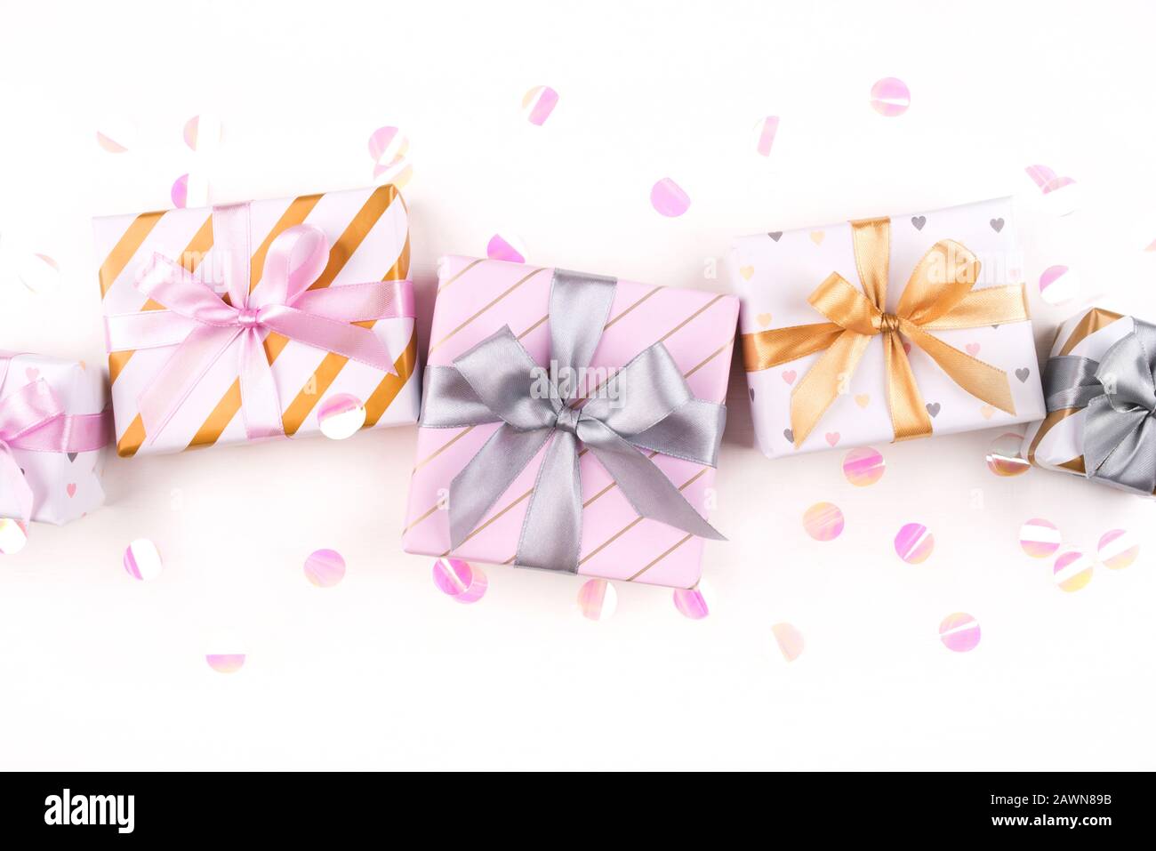 Set of gift boxes with bows and confetti on a white background Stock ...