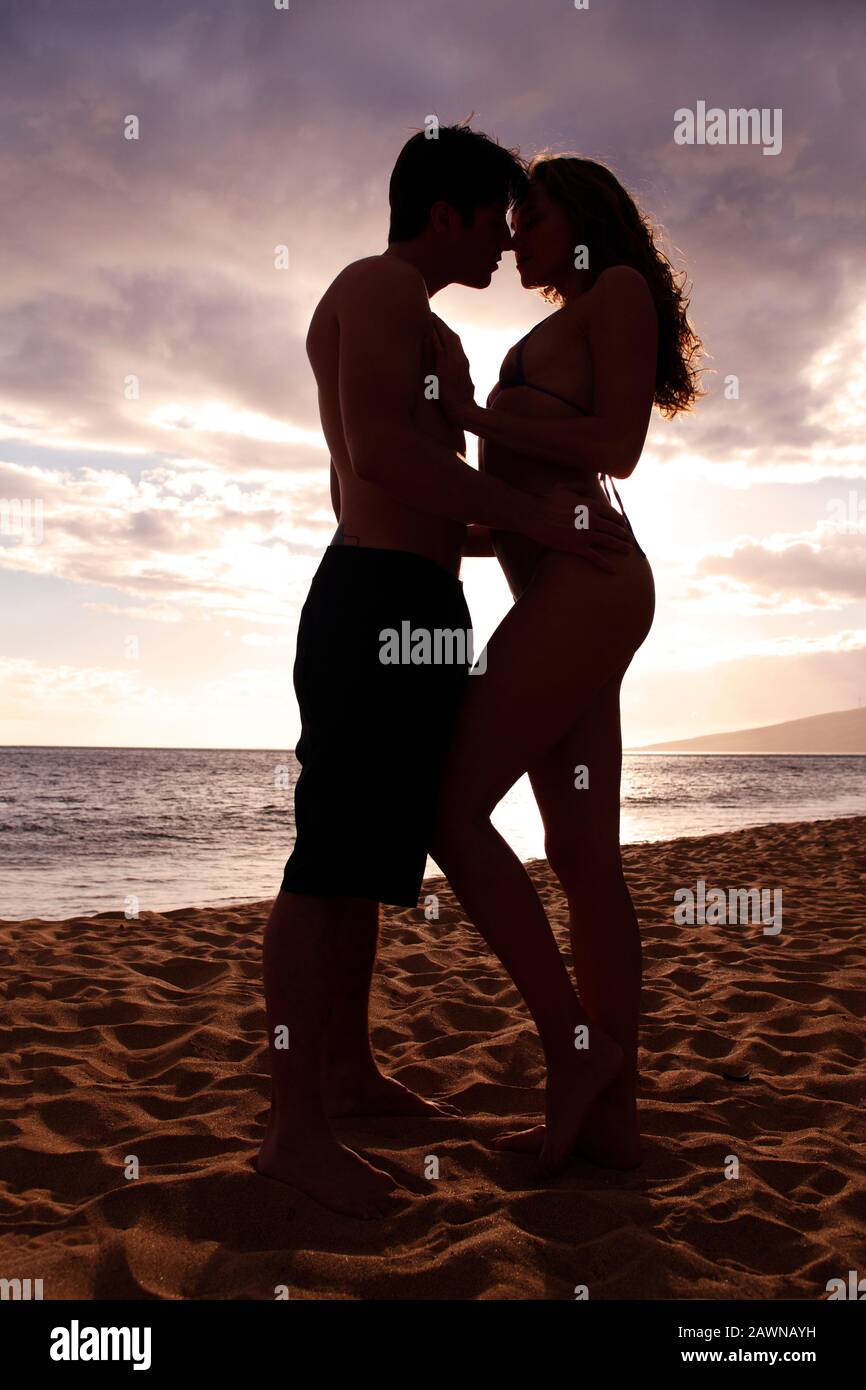 Romantic couple at sunset at Kihei, Maui, Hawaii. Stock Photo