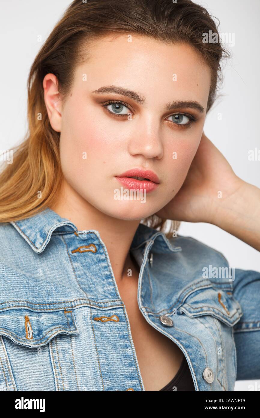 Young teenage girl studio Portrait looking to the camera. Natural face. Vertical photo Stock Photo