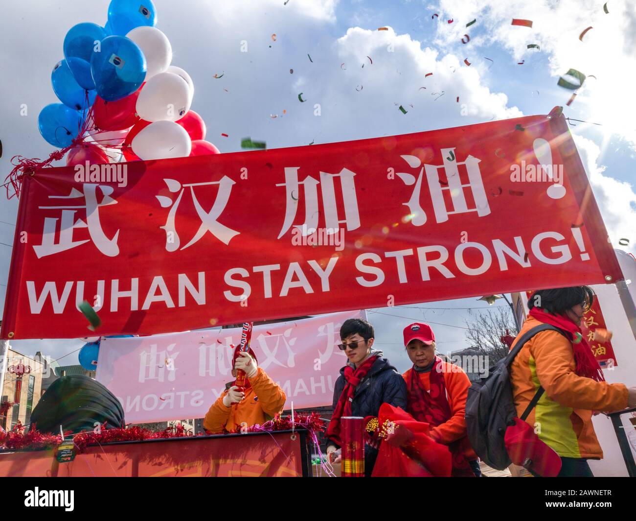New York, USA. 9th Feb, 2020. A message supporting Wuhan, the city where the current coronavirus epidemic originated, is displayed during the Chinese New Year parade in Chinatown. Credit: Enrique Shore/Alamy Live News Stock Photo