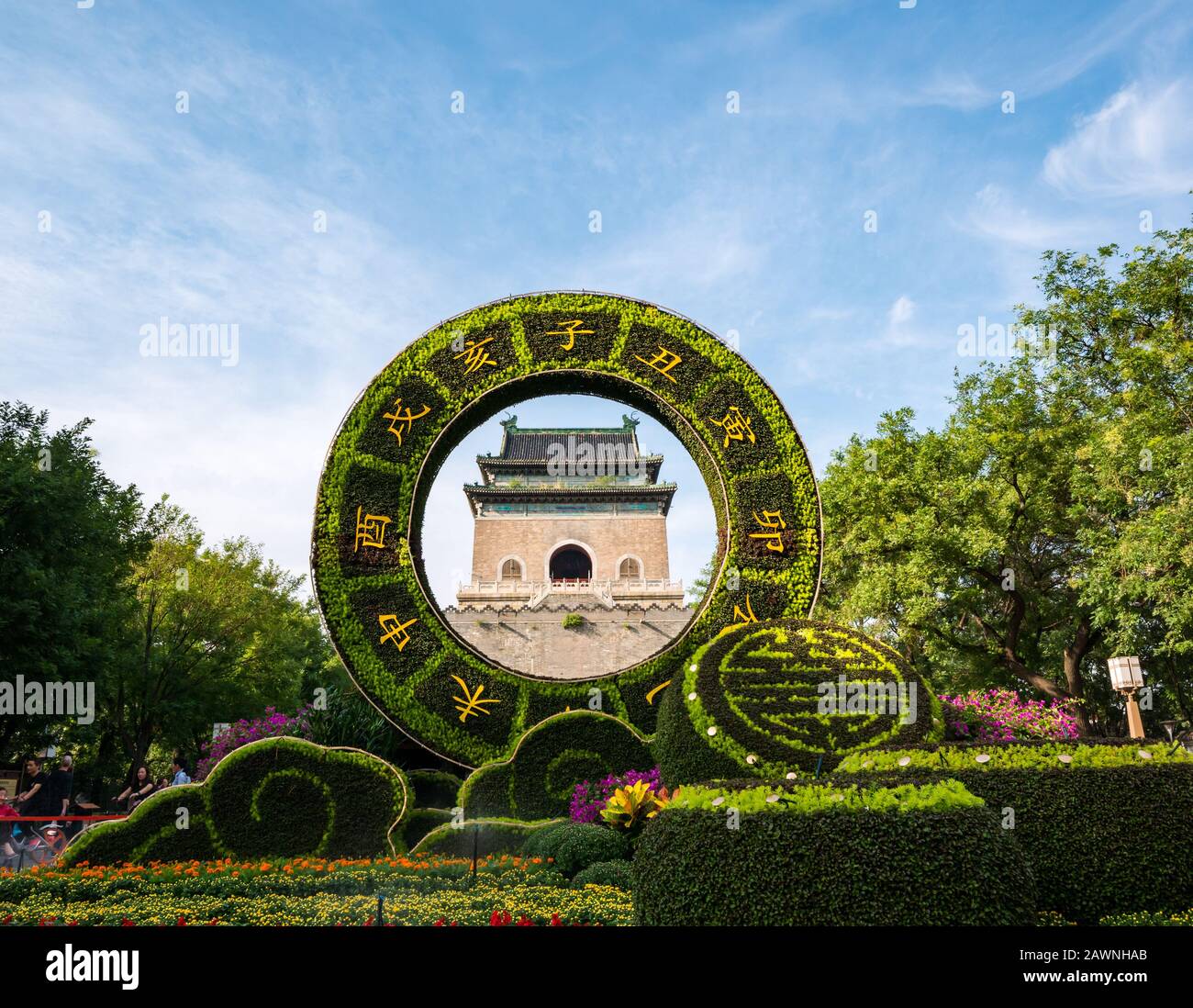 View of Bell Tower or Zhonglou framed though floral display,  Hutong District, Beijing, China, Asia Stock Photo
