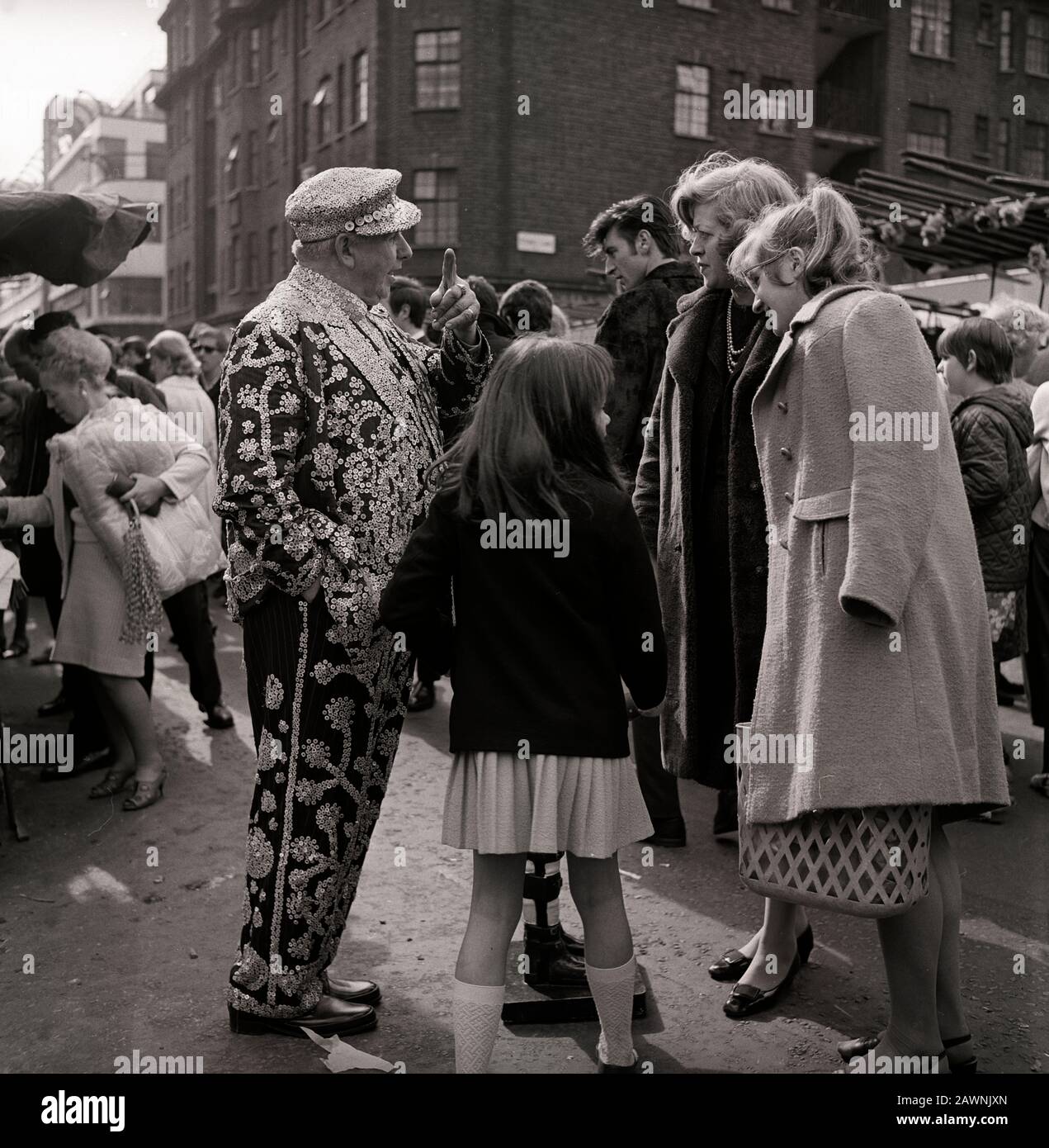 A Pearly King collecting money for Spastic children at the Petticoat Lane Market in East London Stock Photo