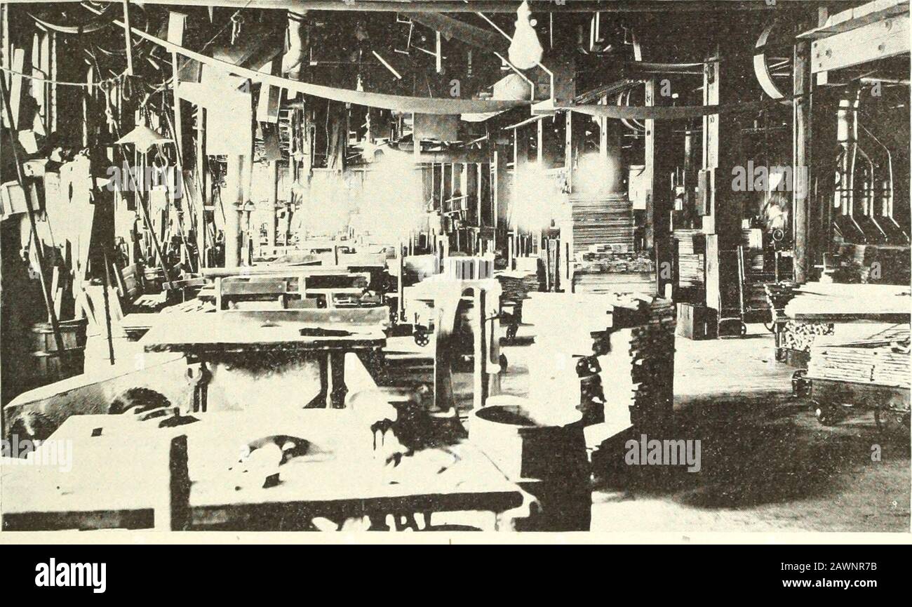 Canadian wood products industries . Cabinet department at the plant of the Geo. McLagan Furniture Company.. Part of the machine department in the Geo. McLagan Furniture Companys factory. what condition it is in when it goes in. It generallyrequires about a week, however, or a little longer. After being- taken from the kiln the lumber is runinto the factory on trucks as required, and put directlythrough a special planer to show the grain or placedat the several swing saws by means of overhead tracksand block and tackle ]Hilleys. The swing sawyers cut it roughly to the lengthsmarked on the stock Stock Photo