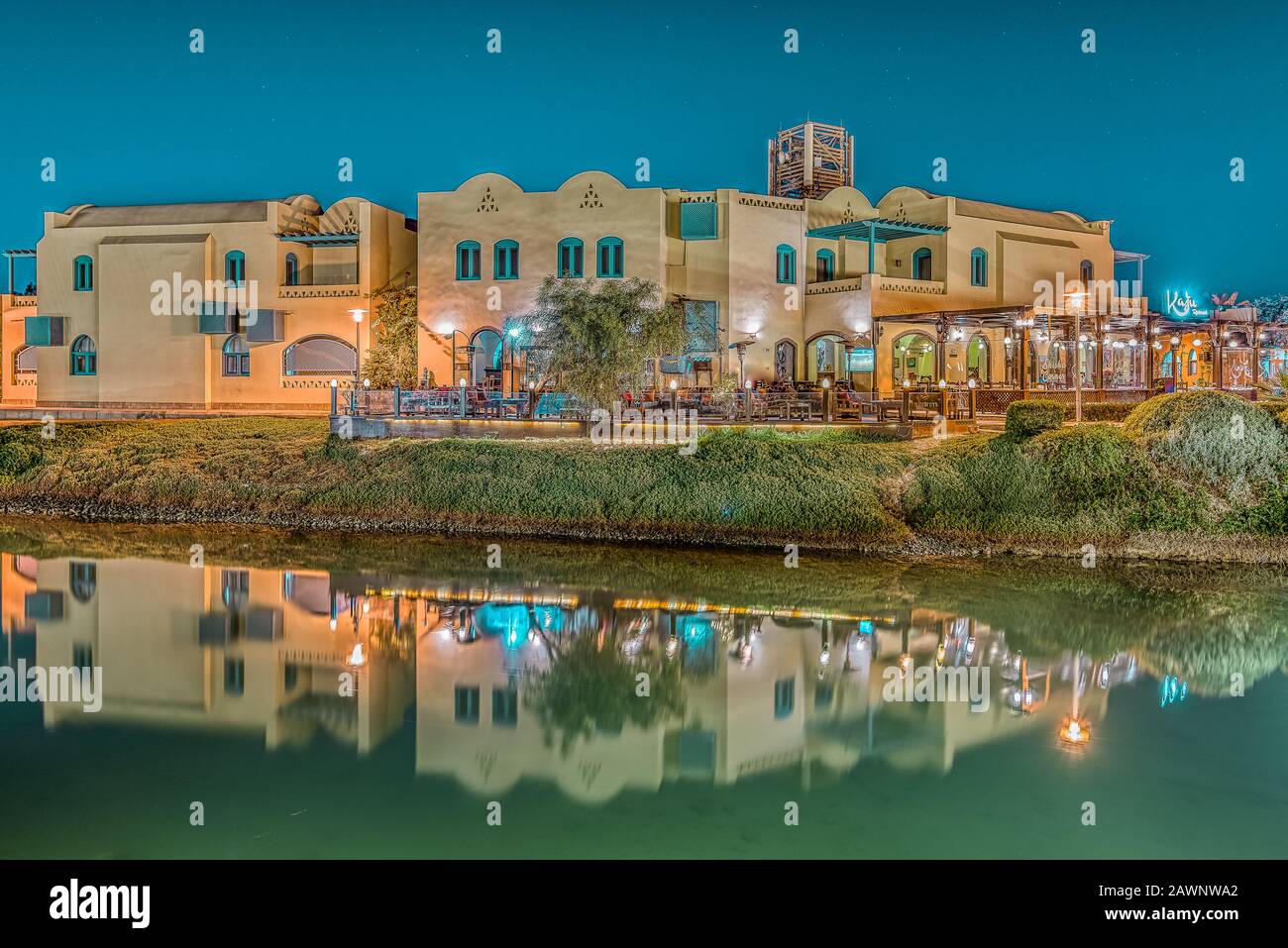 Egypian restaurants at night reflecting in the calm water of the lagoon, el Gouna, Egypt, January 16, 2020 Stock Photo