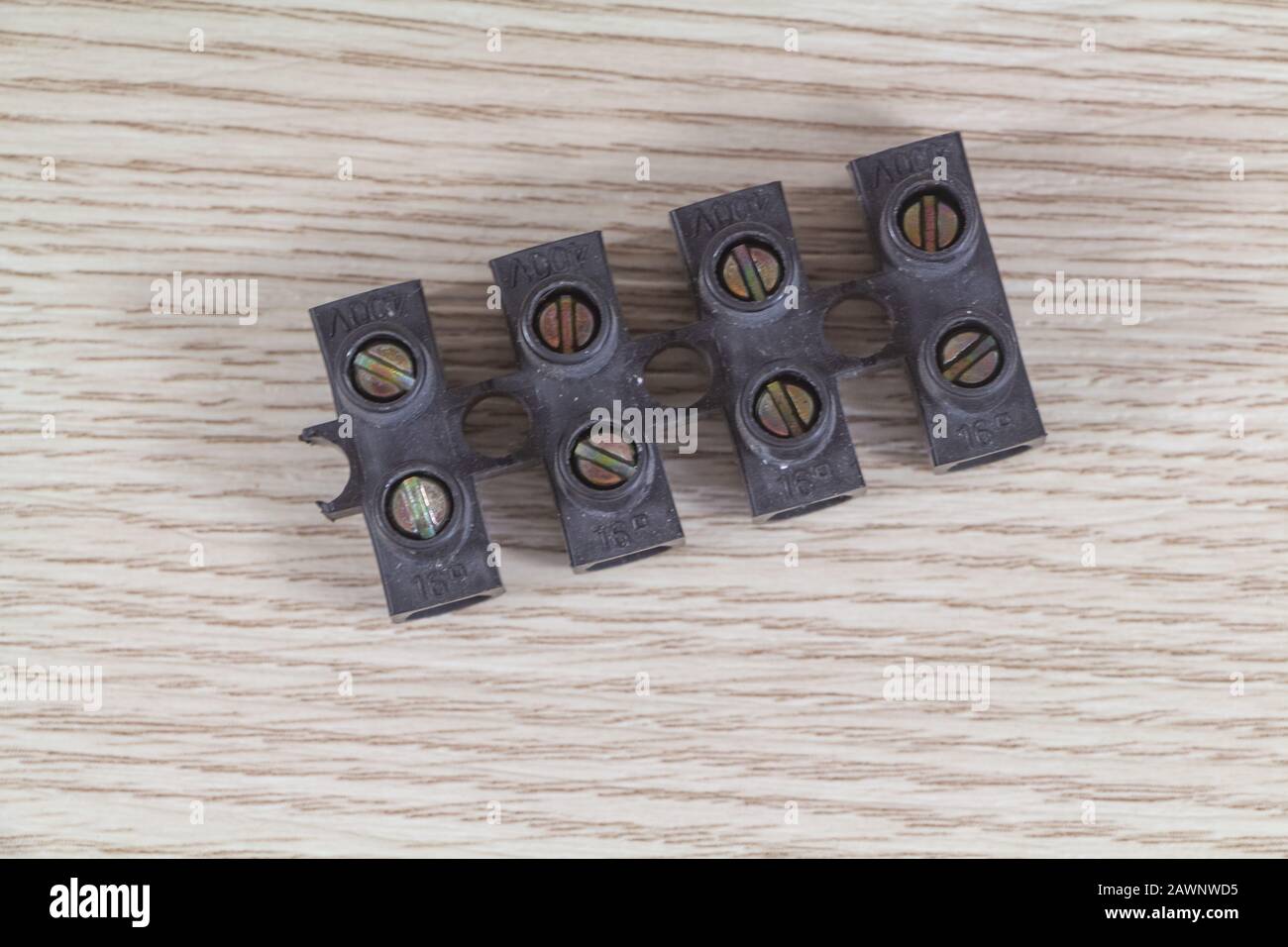 Black connecting block for connecting wires on wooden background Stock Photo