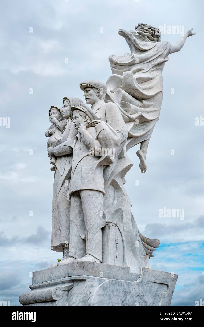 Monument to the Immigrant marble statue by Italian sculptor Franco Alessandrini, Waldenberg Riverfront Park, River Walk, New Orleans, Louisiana, USA Stock Photo