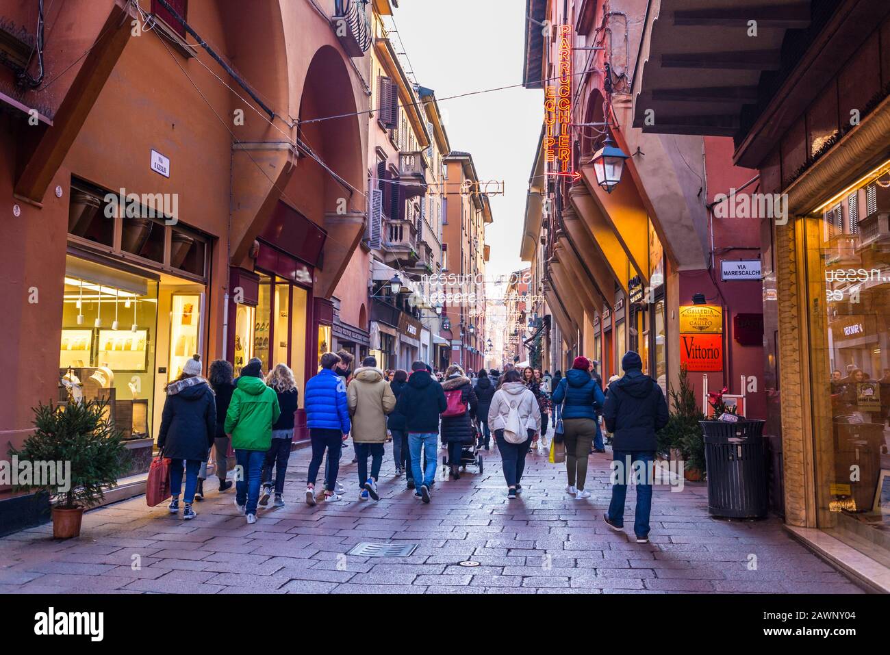 Bologna, Italy - December 2019 People walking in Via d'Azeglio, a famous street full of high end shops in the characteristic medieval city centre of B Stock Photo
