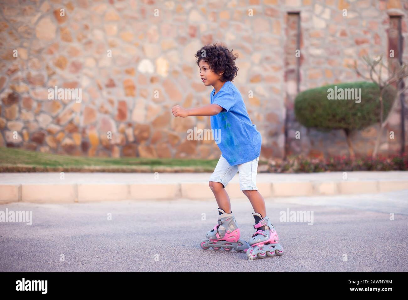 Happy kid boy roller skate in the park. Children, lifestyle and activity  concept Stock Photo - Alamy