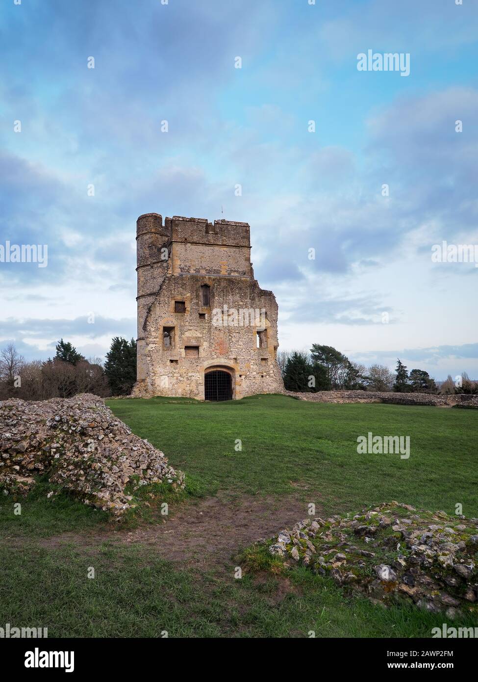The ruins of the medieval Donnington Castle at sunset with colourful clouds in the evening sky, Newbury, Berkshire Stock Photo