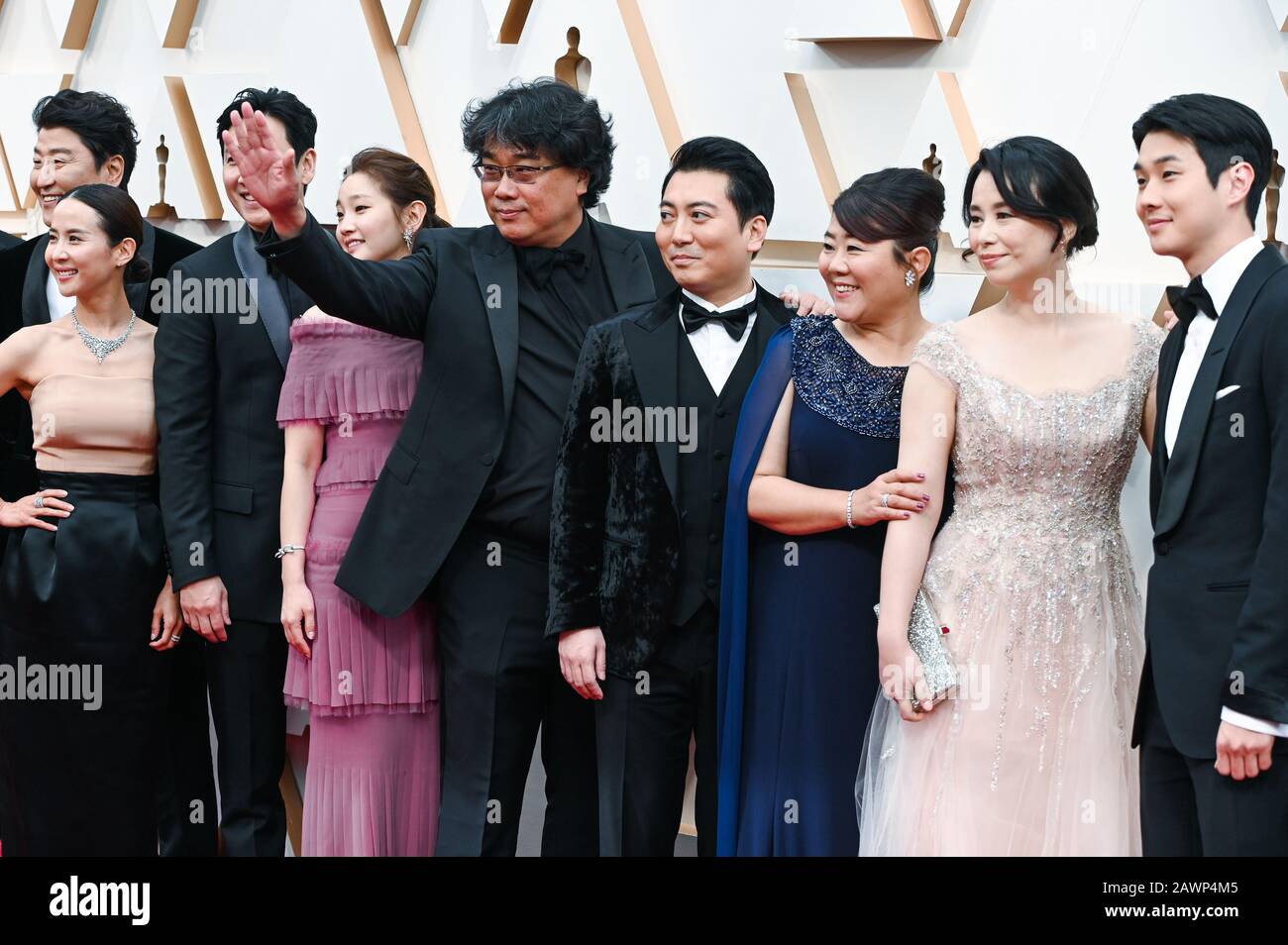 Parasite director Bong Joon Ho and cast members walking on the red carpet  at the 92nd Annual Academy Awards held at the Dolby Theatre in Hollywood,  California on Feb. 9, 2020. (Photo