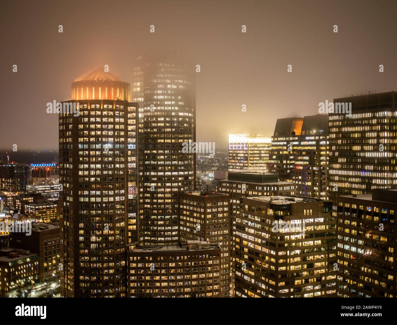Boston Massachusetts, December 17, 2019: One and Two International Place Lit Up At Night Stock Photo