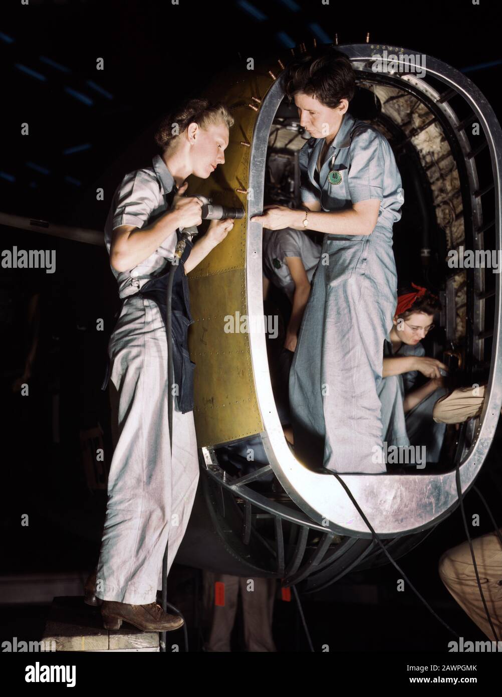 Riveters at work on Fuselage of Liberator Bomber, Consolidated Aircraft Corp., Fort Worth, Texas, USA, photograph by Howard R. Hollem, U.S. Office of War Information, October 1942 Stock Photo