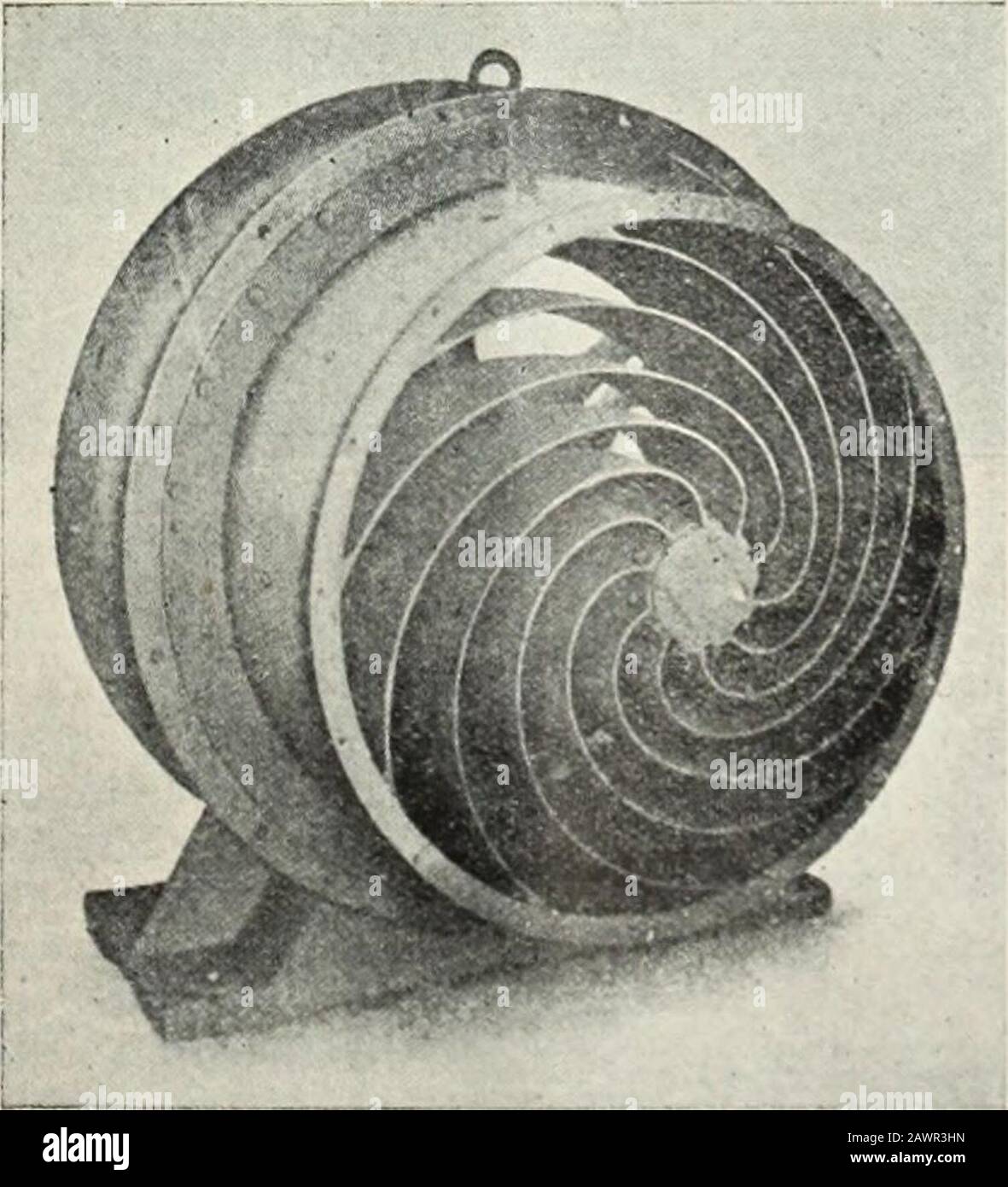 S.Amining and engineering journal . Fig. 1.—Schlotter-blower with a free shaft-end. View ofthe fan or air propeller. We have in mind a case in point, where, on a flat reef.mostly in soft picking ground, the monthly footage wastrebled with the same labour force, due solely and entirelyto the provision of a fan and pipe line. In the case of blasting ground the exhaust from themachines cannot compensate for a supply of fresh air. andit is established by test that the most efficient means ofsupplying this necessary air is by means of an electrically-driven fan. Setting aside therefore both air and Stock Photo