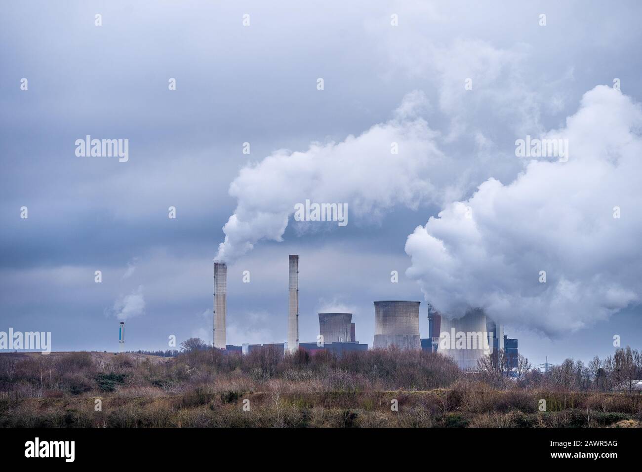 Wide angle shot of white smoking coming out of nuclear plants Stock Photo