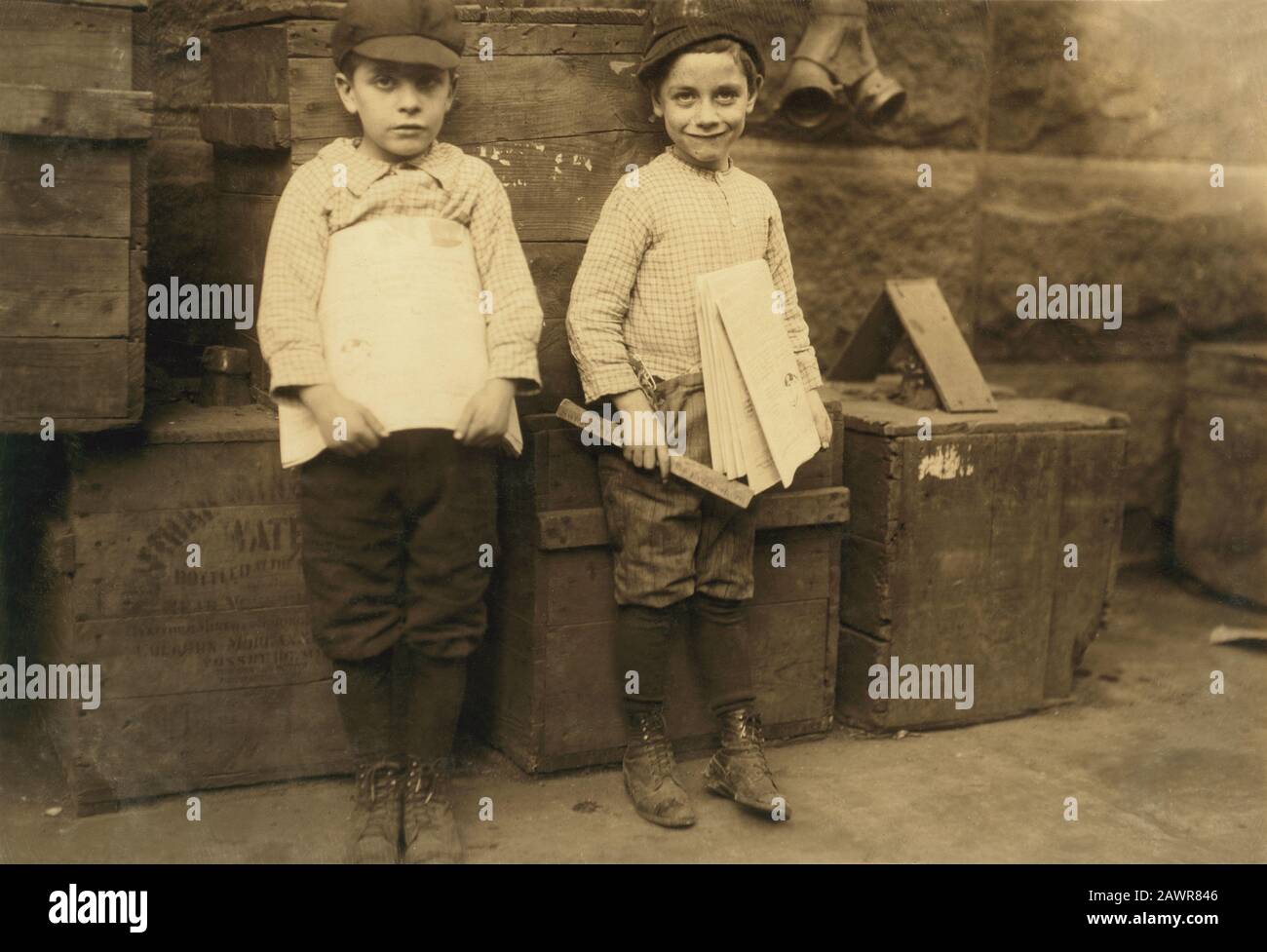 1913 , december, NEW ORLEANS,  Louisiana, USA  : Two of the very youngest newsboys I could find in New Orleans. Seven and nine years old. Such little Stock Photo