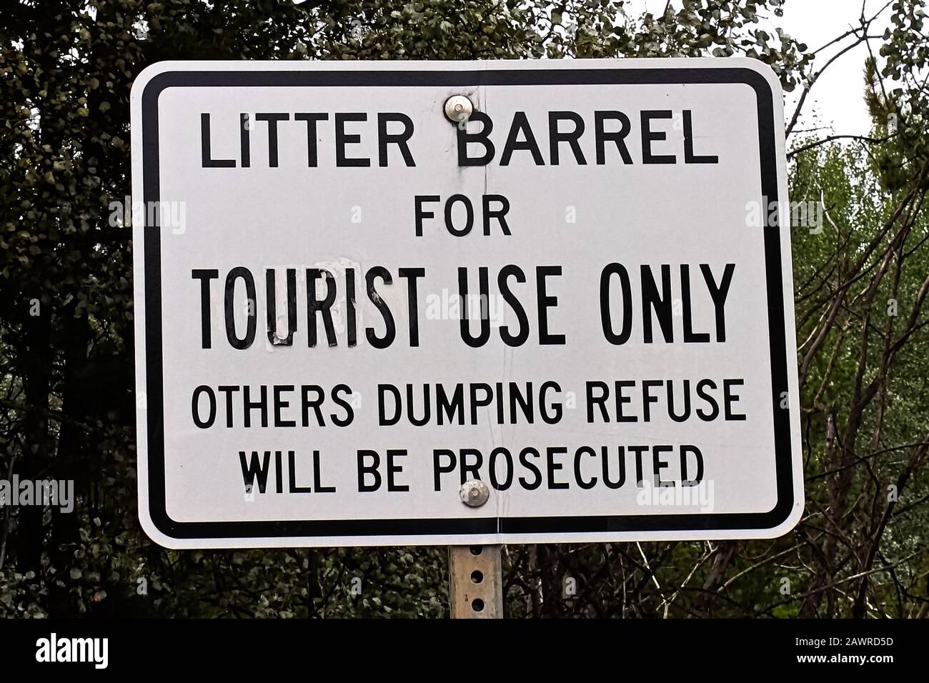 A litter barrel for tourist use only sign Stock Photo Alamy