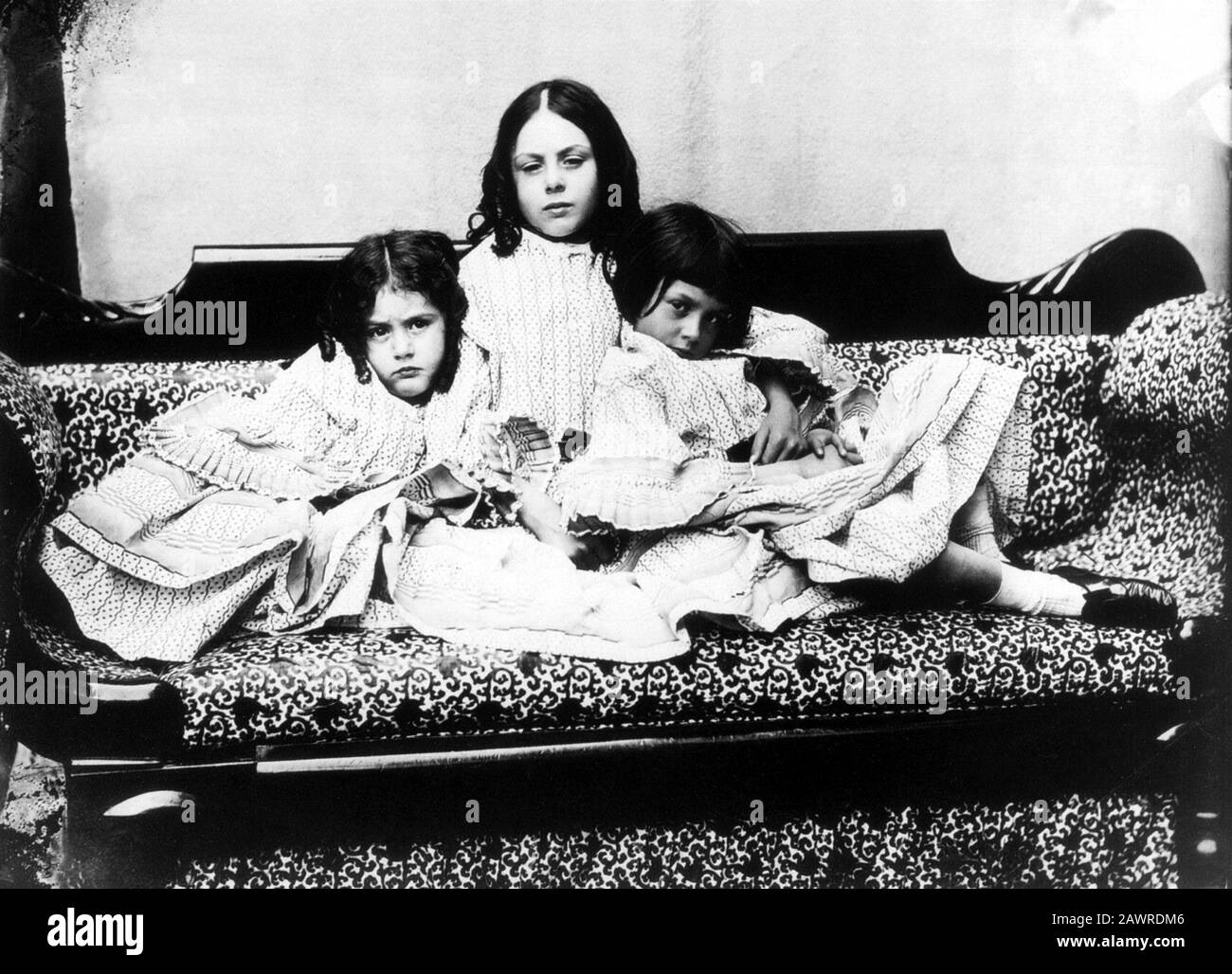 1858 , GREAT BRITAIN : Alice Liddell (first from right ,  the little Muse  model for ALICE IN WONDERLAND - 1865  ) portraied with the sisters Edith an Stock Photo