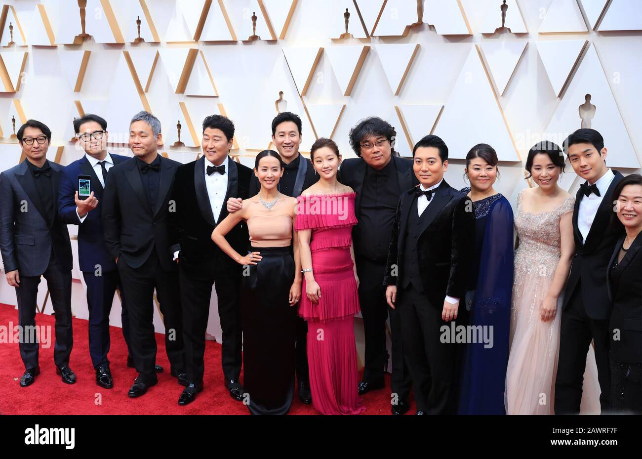 Parasite director Bong Joon Ho and cast members walking on the red carpet  at the 92nd Annual Academy Awards held at the Dolby Theatre in Hollywood,  California on Feb. 9, 2020. (Photo