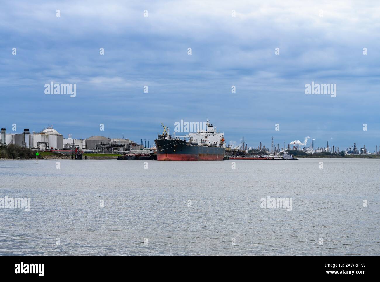 Cargo ship docked at a petrochemical terminal along Gulf of Mexico. Houston, Texas, USA. Stock Photo
