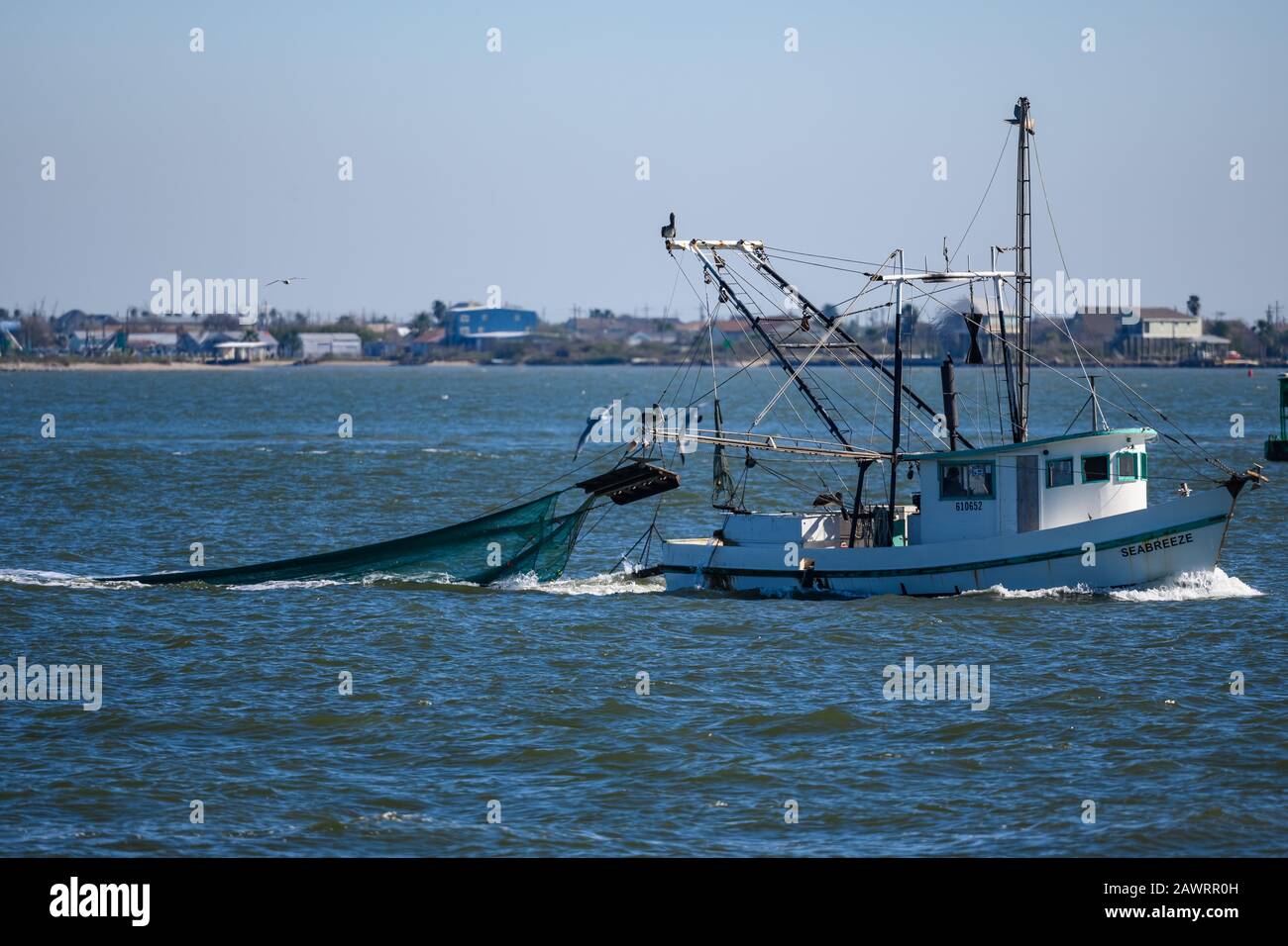 A shrimp boat operating in the Gulf of Mexico near Galveston, Texas, USA. Stock Photo