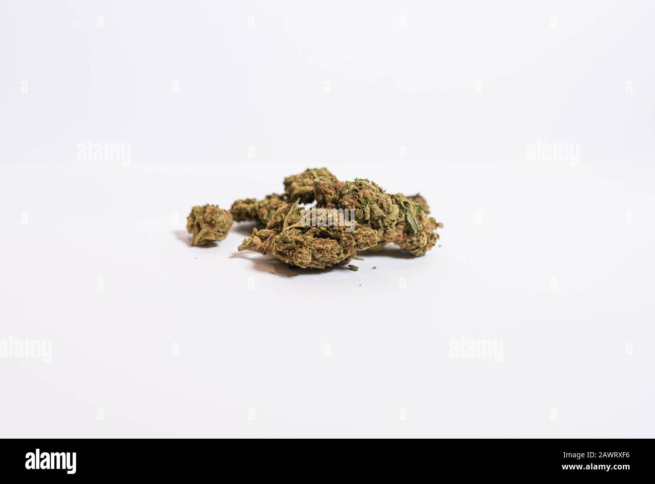 Freshly cured marijuana on soft whitebox background Stock Photo