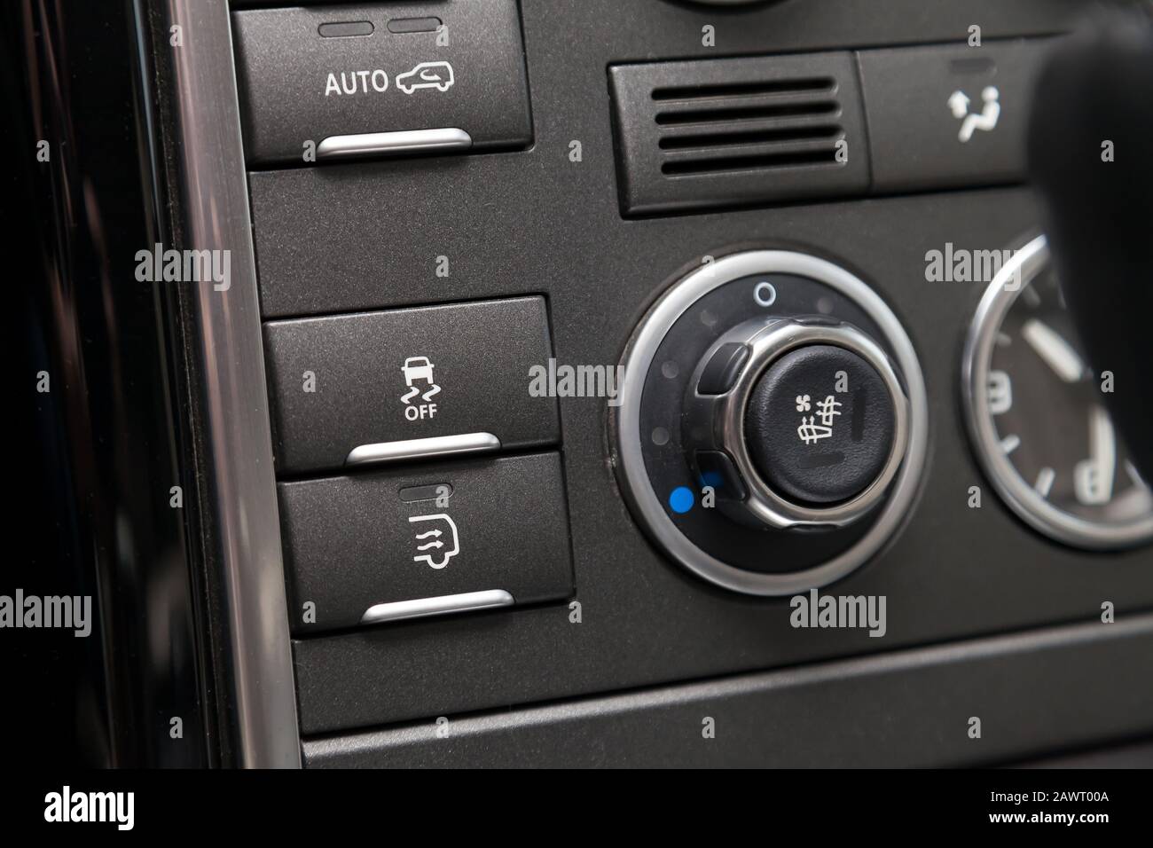 The button for the stability control system, side mirrors adjust and