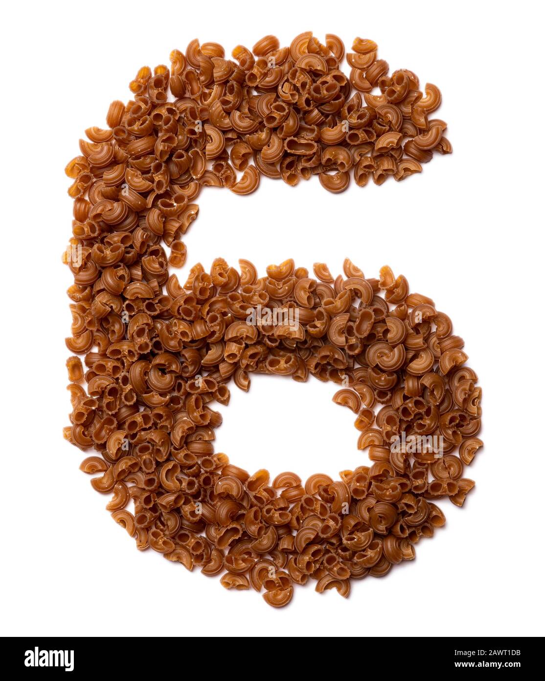 Arabic numeral "6" from dry pasta from buckwheat amaranth flour on a white isolated background