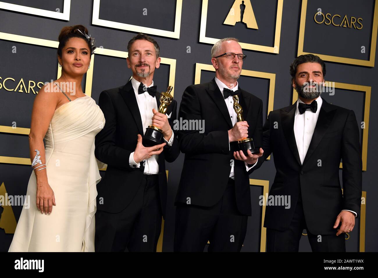 Selma Hayek and Oscar Issac present Mark Taylor and Stuart Wilson with