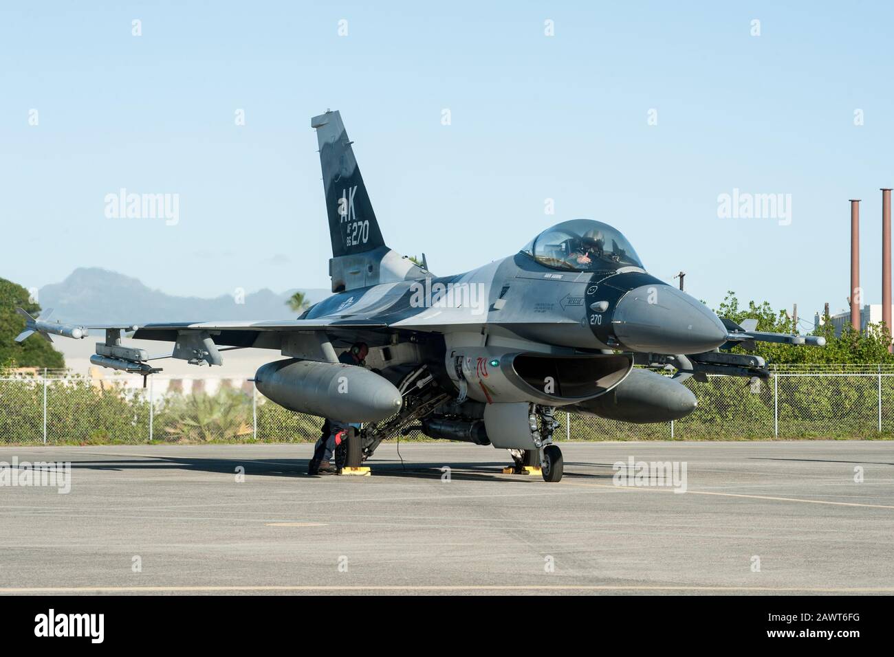 An F-16 Fighting Falcon from the 18th Aggressor Squadron prepares for flight Feb. 4, 2020, at Joint Base Pearl Harbor-Hickam, Hawaii. The aircraft practiced combat tactics alongside the world’s most advanced fifth-generation airframes, the F-22 Raptor and F-35A Lightning II. The F-16 is assigned to the 18th Aggressor Squadron in Eielson Air Force Base, Alaska, and its mission is to prepare pilots for victory by simulating combat tactics which are likely to be faced in the event of an air-to-air battle.  (U.S. Air National Guard photo by Senior Airman John Linzmeier) Stock Photo