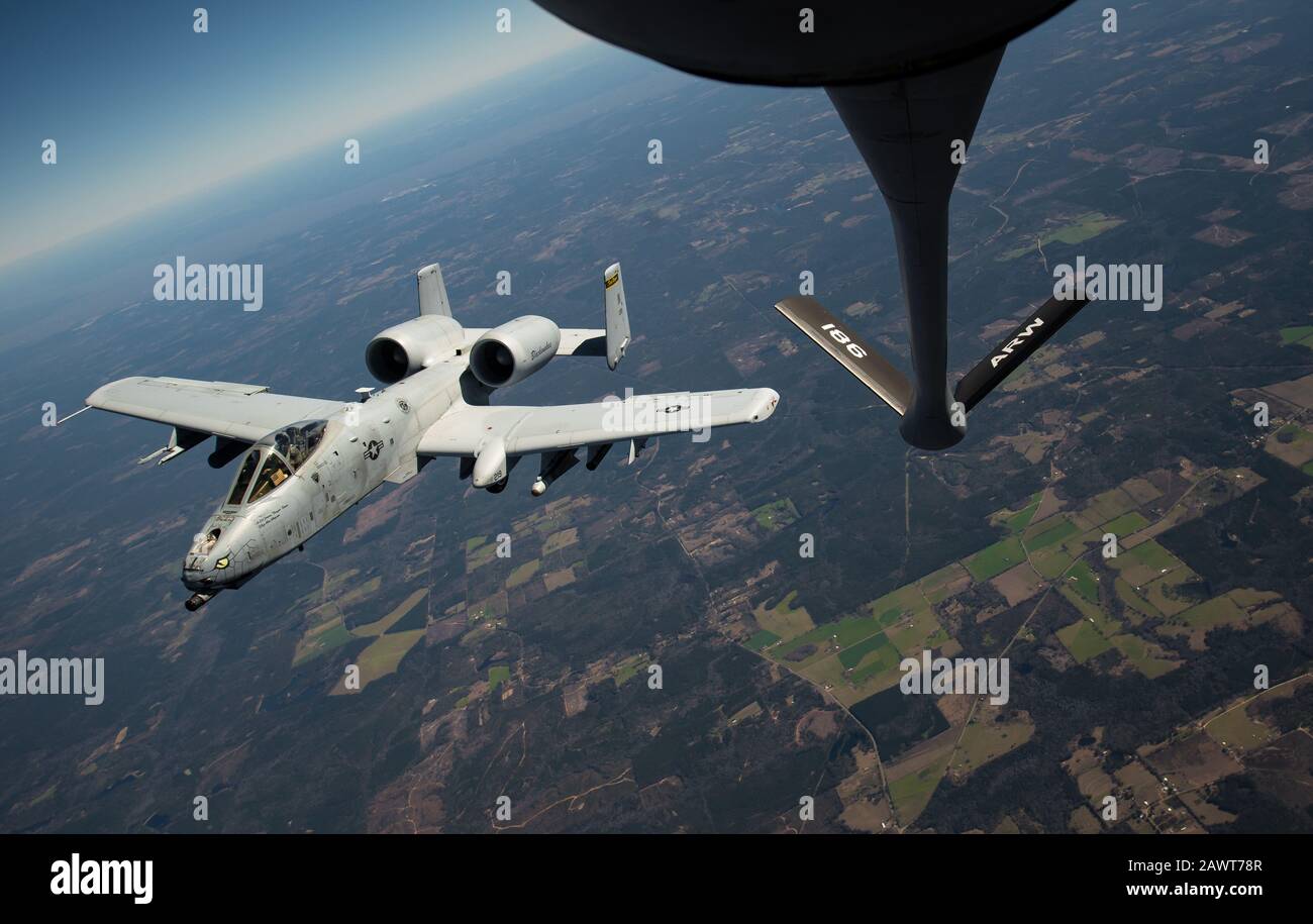 U.S. Air Force A-10 Thunderbolt II departs after receiving fuel from a Mississippi Air National Guard KC-135 Stratotanker assigned to the 186th Air Refueling Wing during a refueling mission as part of Southern Strike 2020 over the Gulfport Combat Readiness Training Center, Miss., Feb. 7, 2020. Southern Strike is a large-scale, joint and international combat exercise, which features counter insurgency, close air support, non-combatant evacuation, and maritime special operations. (U.S. Air Force photo by Staff Sgt. Trevor T. McBride) Stock Photo