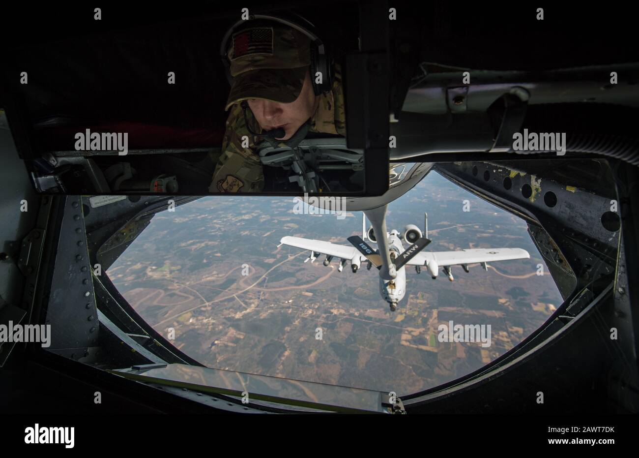 A U.S. Air Force KC-135 Stratotanker boom operator, assigned to the Mississippi Air National Guard 186th Air Refueling Wing, refuels an A-10 Thunderbolt II as part of Southern Strike 2020 over the Gulfport Combat Readiness Training Center, Miss., Feb. 7, 2020. Southern Strike is a large-scale, joint and international combat exercise, which features counter insurgency, close air support, non-combatant evacuation, and maritime special operations. (U.S. Air Force photo by Staff Sgt. Trevor T. McBride) Stock Photo