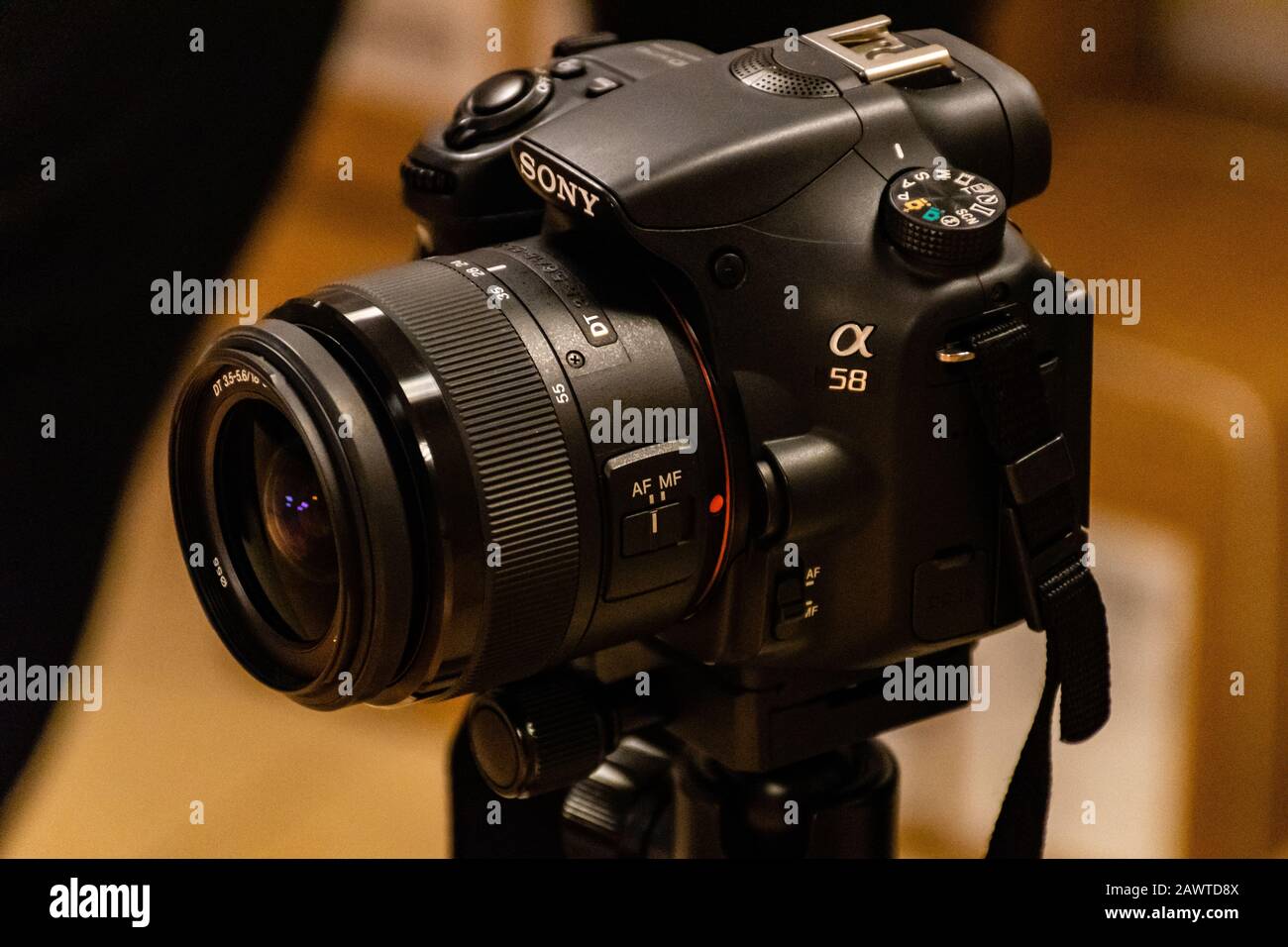 Sony alpha a58 camera with 18-55 mm Sony lens fixed on a tripod ready to shoot Stock Photo