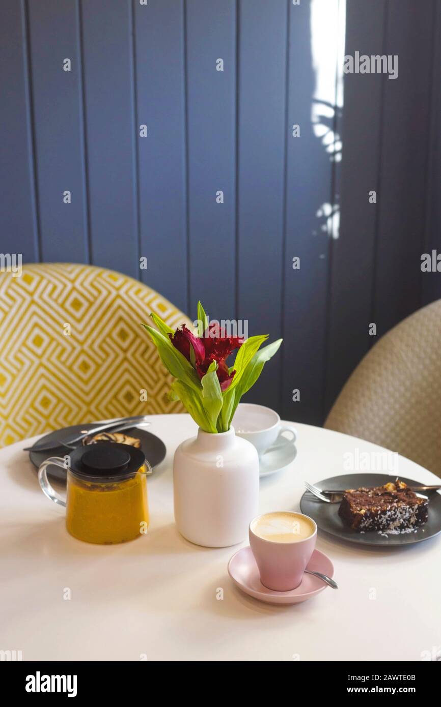 Breakfast with coffee, tea and pastries at a cozy table of a modern ...