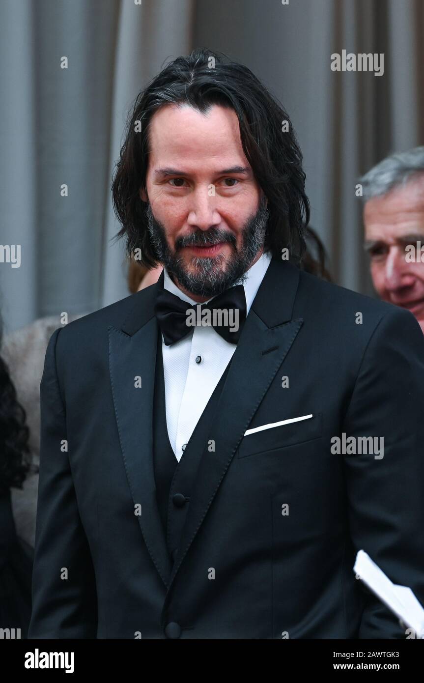 Keanu Reeves walking on the red carpet at the 92nd Annual Academy