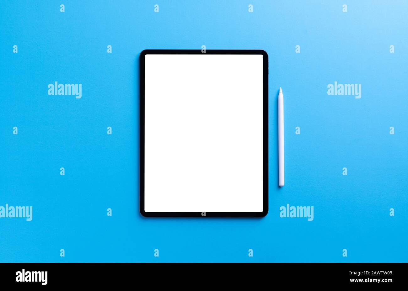 digital tablet and stylus pen on light blue background Stock Photo Alamy