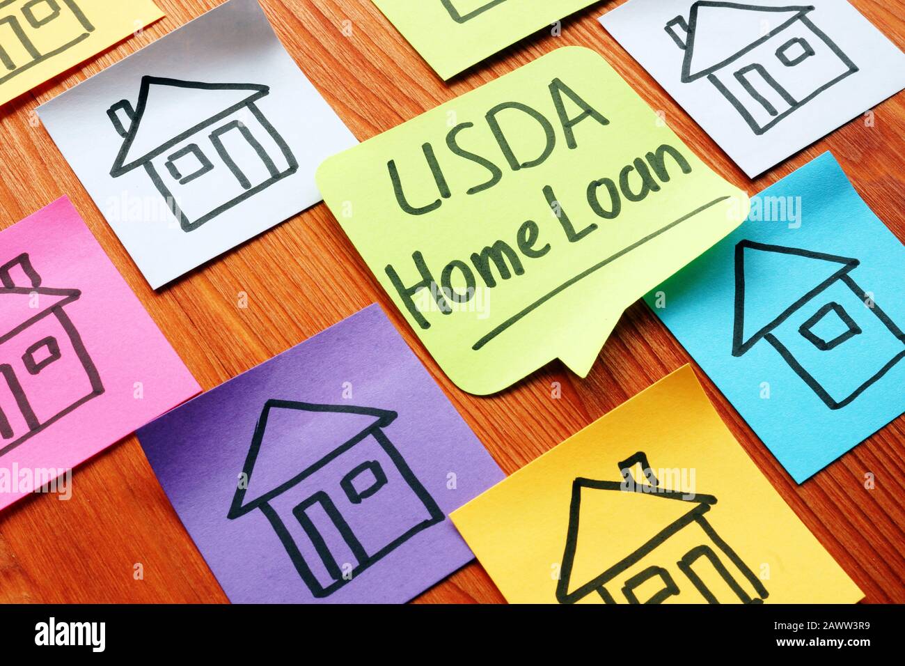 USDA home loan and drawn homes on a paper. Stock Photo
