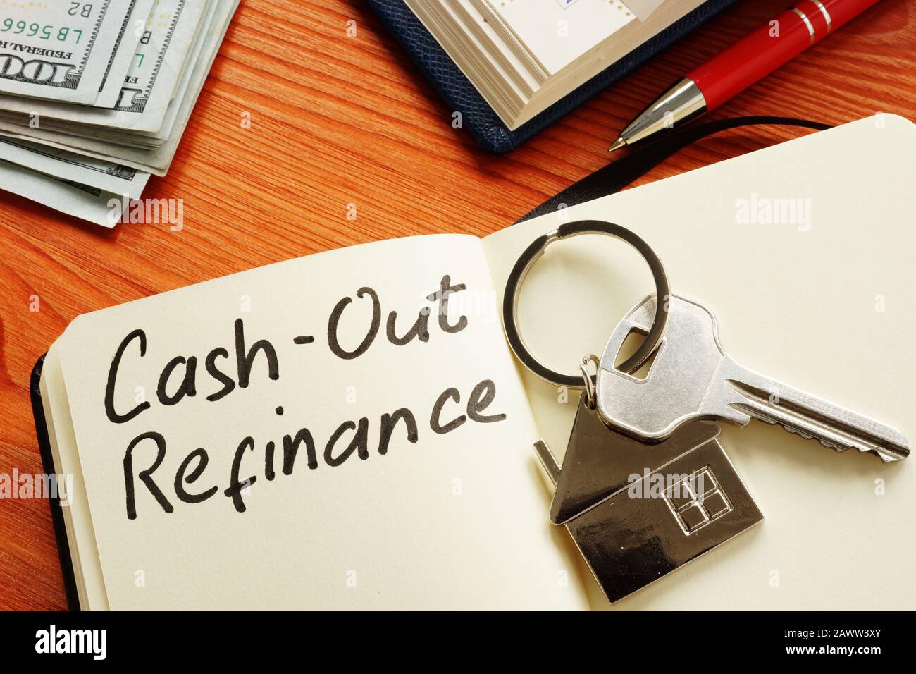Cash out refinance and key on the notepad. Stock Photo