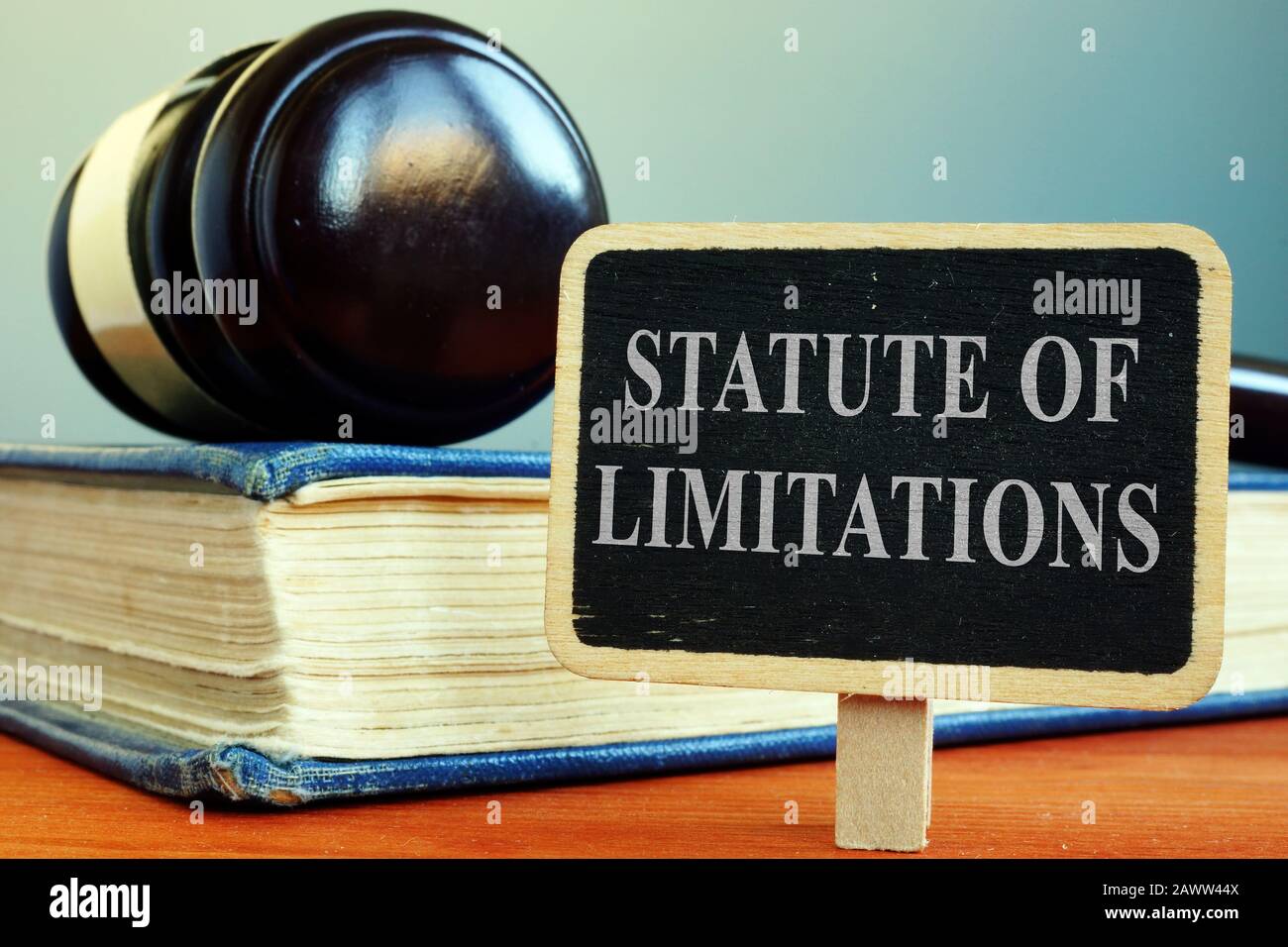 Statute of limitations sign, book and gavel Stock Photo Alamy