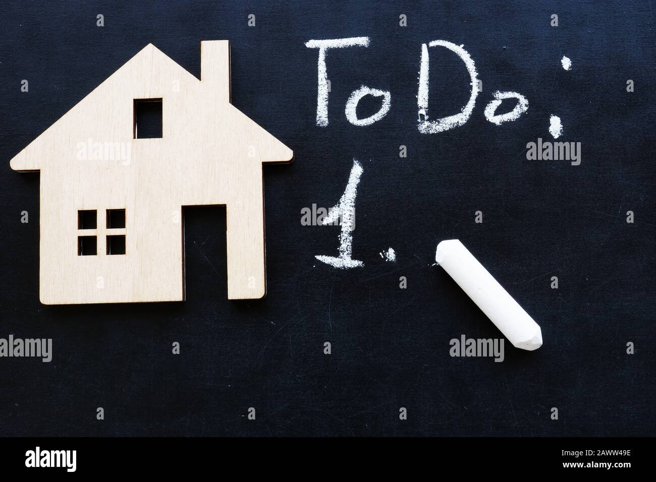 Tiny home and to do list for buy property or mortgage. Stock Photo
