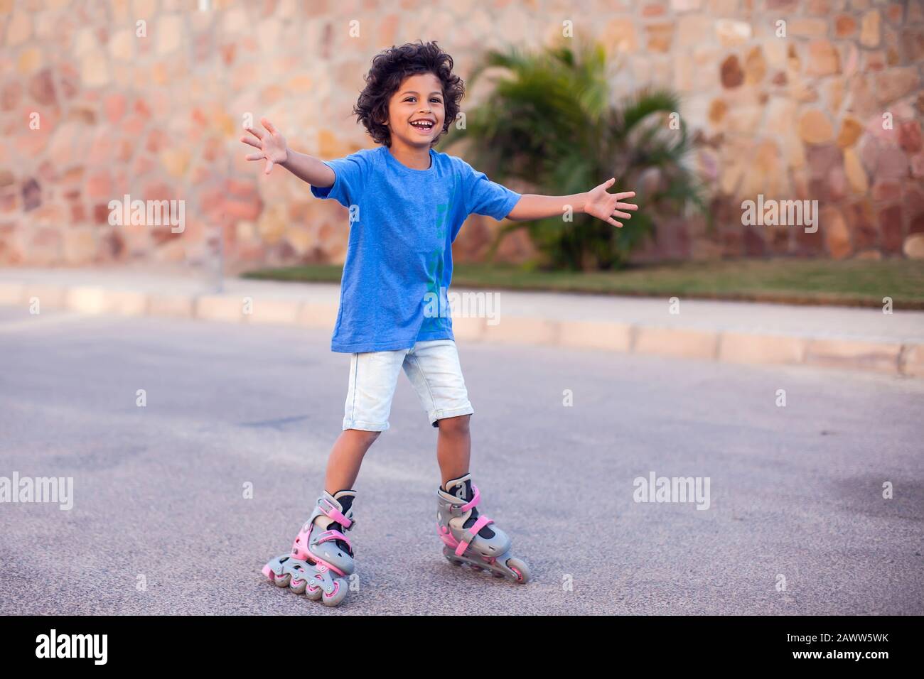 Happy kid boy roller skate in the park. Children, lifestyle and activity  concept Stock Photo - Alamy